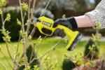Ryobi garden tools secateurs being used comfortably with thick gardening gloves, reducing fatigue.